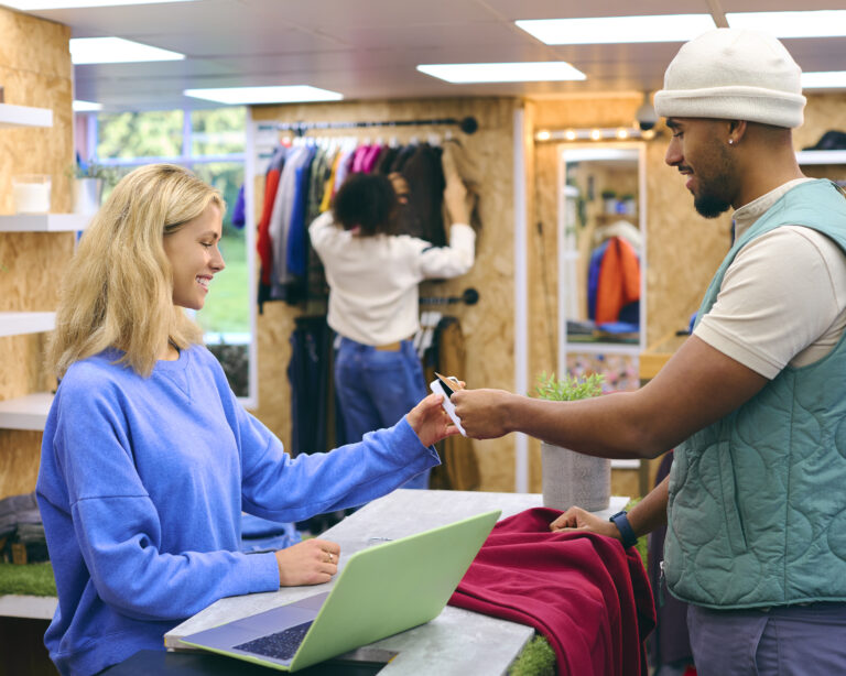 Male Customer Paying Female Sales Assistant In Fas 2024 10 19 07 10 32 Utc
